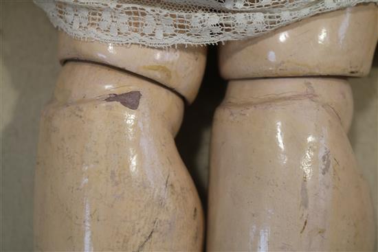 A late 19th century German bisque head doll 29in.